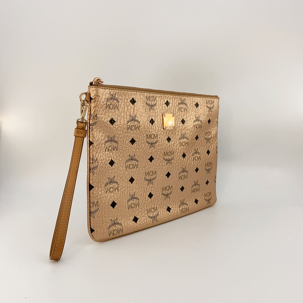 MCM CLUTCH IN CHAMPAGNE GOLD