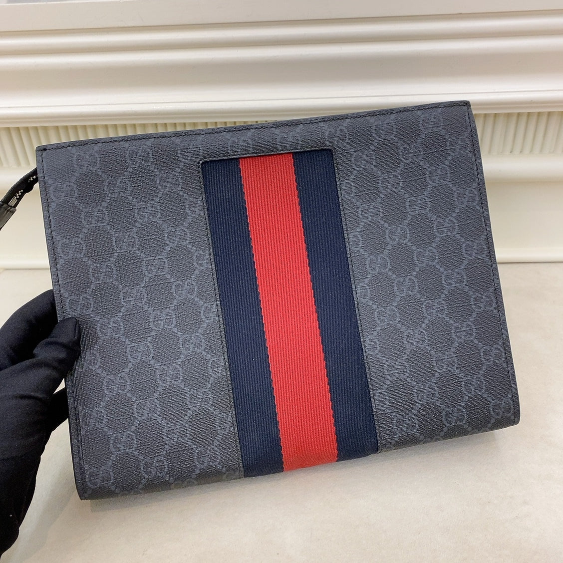 Gucci supreme web outlet pouch