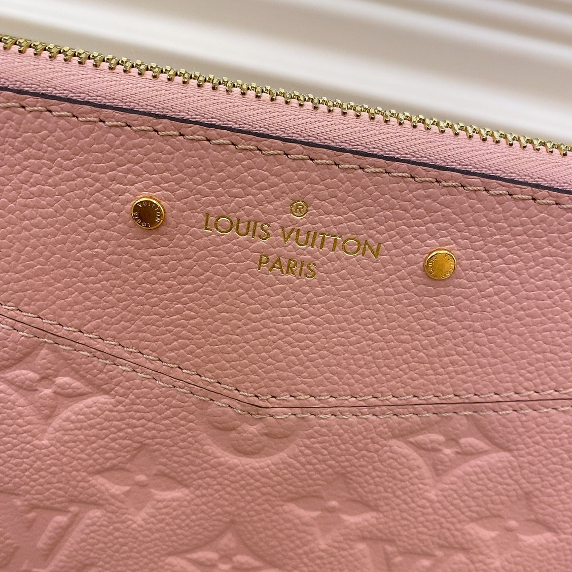 LV Empreinte Daily Pouch in Pink